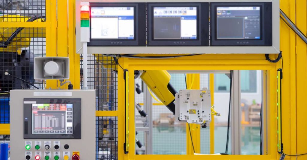 An operation panel displaying real-time data and controls, alongside a product inspection monitoring display.